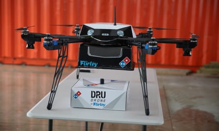 A delivery drone with a pizza box