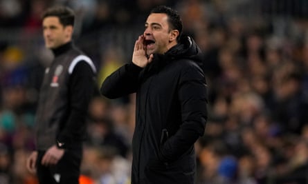 Xavi shouts instructions from the sidelines