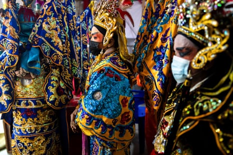 Members of a Chinese opera troupe prepare backstage during the annual vegetarian festival in Bangkok, Thailand.
