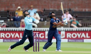 Harmanpreet Kaur skies a ball and is caught for 19 by Kate Cross.