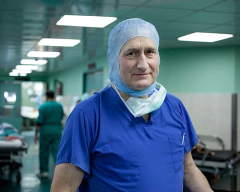 Groom, wearing scrubs in a hospital ward