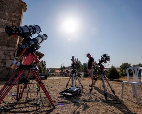 Researchers set up telescopes outdoors in a small Spanish town to observe a solar eclipse