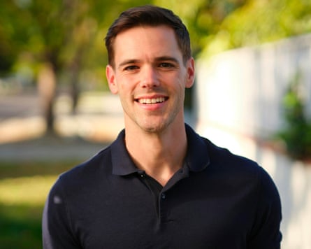 A young man smiles