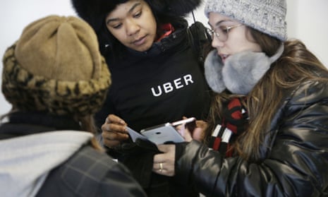 An Uber representative helps travelers find rides with Uber at LaGuardia airport in New York. Uber’s first report on employee diversity shows low numbers for women, especially in technology positions. 