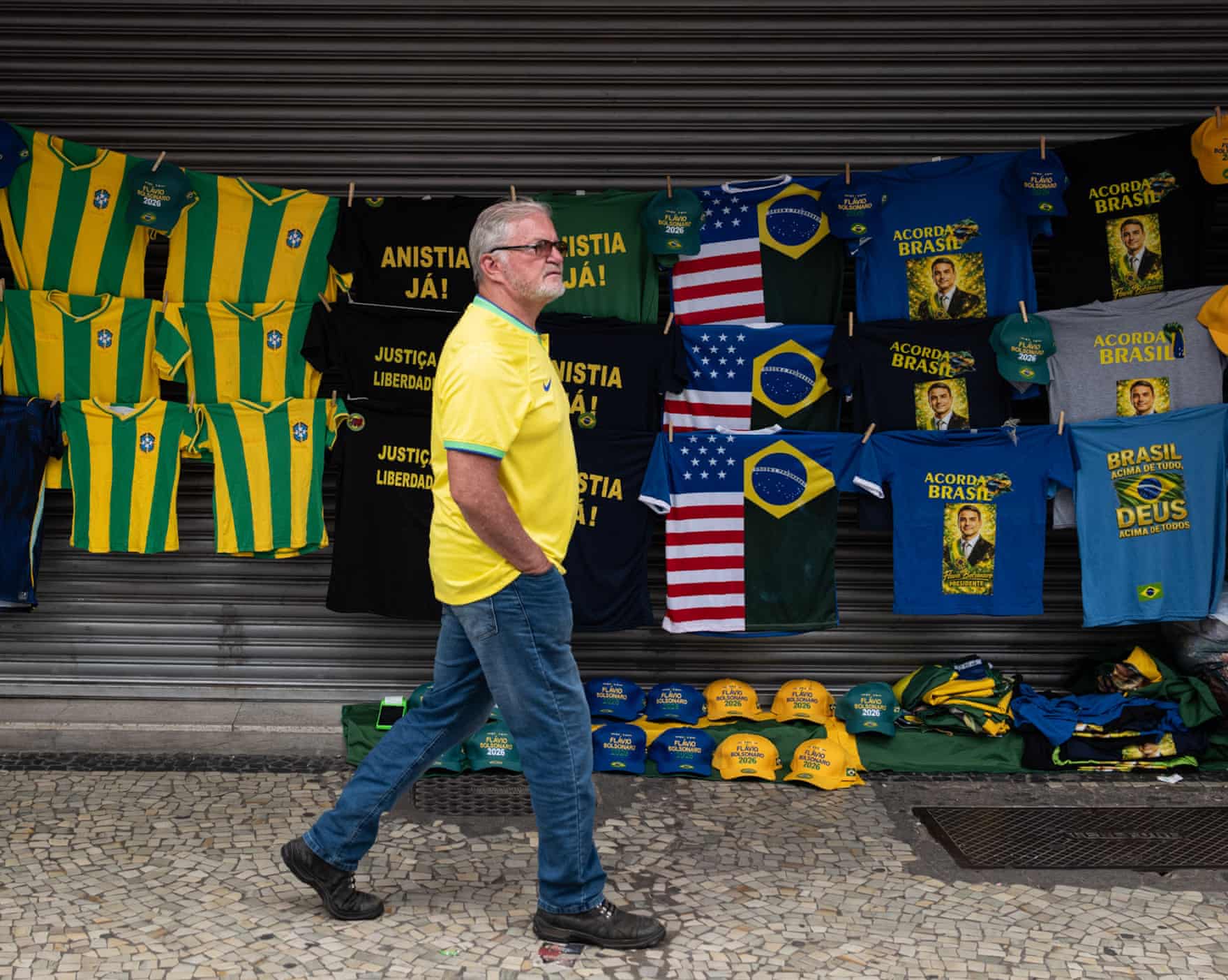 Street hawkers at Flávio Bolsonaro’s campaign event pay tribute to the US connection with half-US-half-Brazil T-shirts