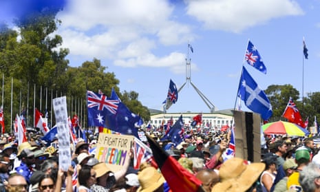 Thousands of people take part in a protest outside Parliament House in Canberra.