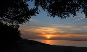 The sun rises during a trackwork session at Balnarring Beach in Balnarring, 20 December 2019.