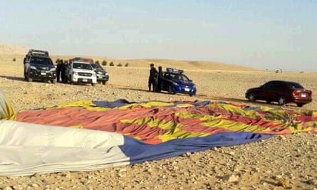 Police inspect the site of the hot air balloon crash landing in Luxor.
