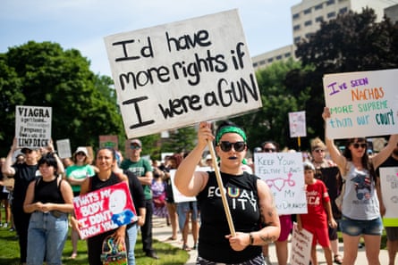 Women in in Lansing, Michigan, protest the US supreme court’s overturning of Roe v Wade.