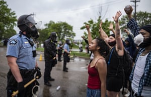 Protesters and police face each other