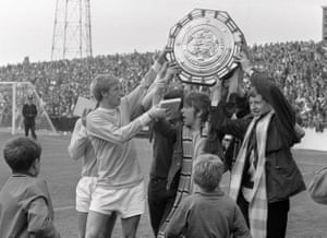 Colin Bell and Manchester City fans hold the Charity Shield aloft after the League Champions beat FA Cup winners West Bromwich Albion 6-1 at Maine Road in August 1968.