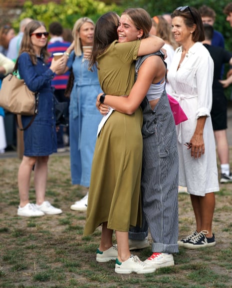 Alice Shaw hugging a person after reading their A-level results at Norwich School, Norwich