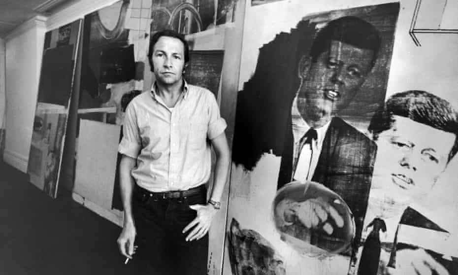 Robert Rauschenberg in his studio, with prints of John F Kennedy.