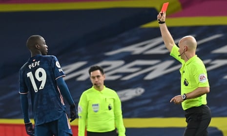 Nicolas Pépé is shown a red card by Anthony Taylor in the second half.