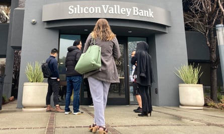 People stand outside a Silicon Valley Bank branch in Santa Clara, California, on 10 March.