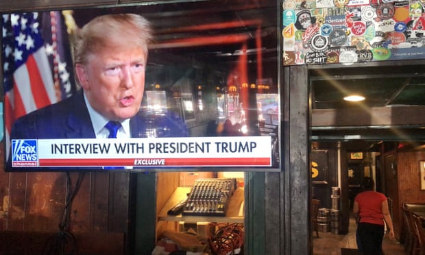 A TV screen showing Donald Trump on Fox News in a bar in Washington DC, 2 February 2020.