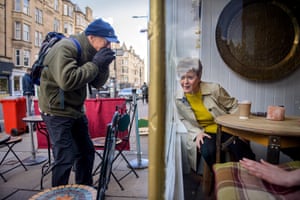 Edinburgh, UK A member of the public interacts with Nicola Sturgeon as she stops for a coffee as she campaigns for the Scottish parliamentary election