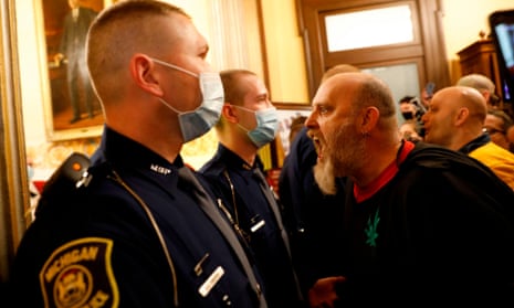Protesters try to enter the Michigan house of representatives chamber.