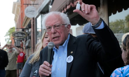 Senator Bernie Sanders holds up a vial of insulin as he talks about the high cost of health care in the US during a rally outside a Canadian pharmacy in Windsor, Ontario.