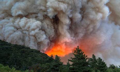 Flames and heavy smoke approach on a western front of the Apple Fire, climbing the steep wilderness slopes of the San Bernardino Mountains in August 2020.