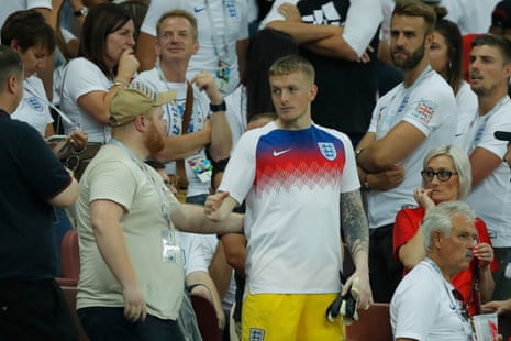 Jordan Pickford receives commiserations after heading up into the stands to see his family.
