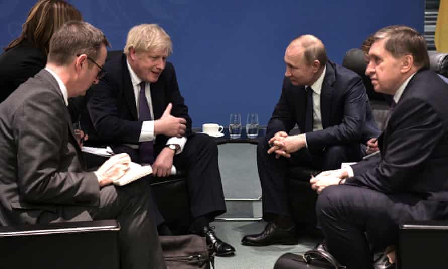Boris Johnson (centre left) speaks with Russian president Vladimir Putin (centre right) during the International Libya Conference in Berlin, Germany, 19 January 2020.