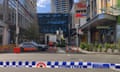 Police tape surrounds a shopping centre