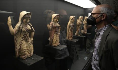 A man looks at archeological artefacts displayed in the Museum of Rescued Art in Rome.
