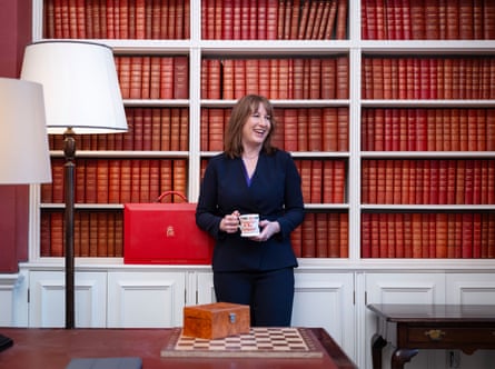 Rachel Reeves holding teacup in front of bookshelves at her office in No 11.