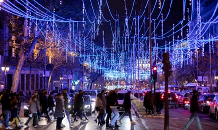 The protest came a week after Madrid switched on its extravagant Christmas lights, pictured.