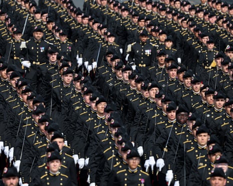 French Ecole Polytechnique members parade during the annual Bastille Day military parade on the Champs-Elysees Avenue in Paris.