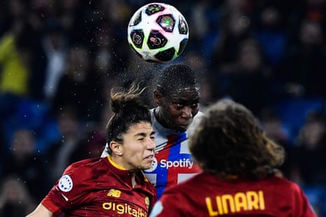 Elisa Bartoli and Barcelona forward Asisat Oshoala go for a header in the Roma penalty area.