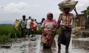 Rohingya people fleeing from Myanmar military operations in Rakhine state cross the Bangladesh border at Cox’s Bazar.