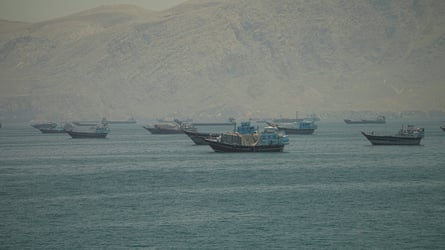 Several small and medium-sized vessels anchored in the strait