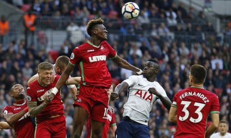Swansea City’s Tammy Abraham heads the ball clear.