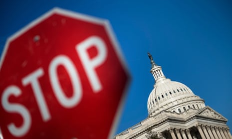 Federal workers were told to stay home after the White House and Congress failed to pass a government spending bill.