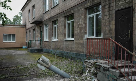 An unexploded ordnance lies in the ground outside a kindergarten in Lysychansk, eastern Ukraine.