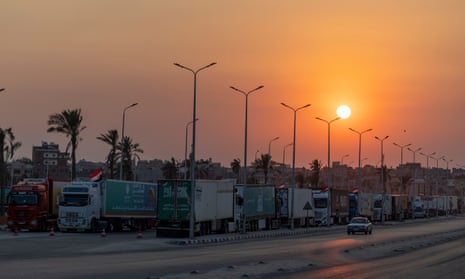 Aid convoy trucks loaded with supplies are seen at Arish City waiting for the Gaza-Egypt border to open on 15 October, 2023 in North Sinai, Egypt.