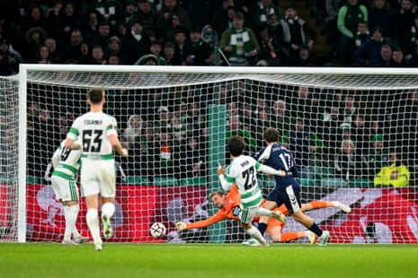 Celtic's Mika Baur shoots past the goalkeeper to score against Celta Vigo