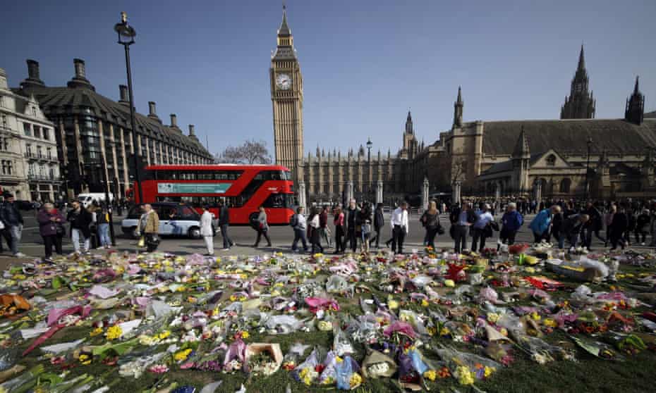 Floral tributes to the victims of the Westminster attack are placed outside the Palace of Westminster, London.