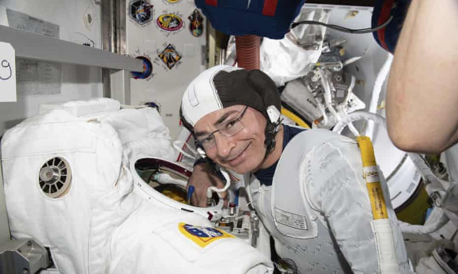 In this August 2021 photo, Mark Vande Hei inspects a spacesuit in preparation for a spacewalk at the International Space Station.