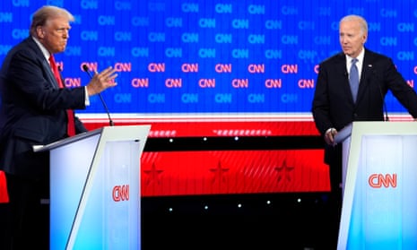 two white men in suits stand at podiums
