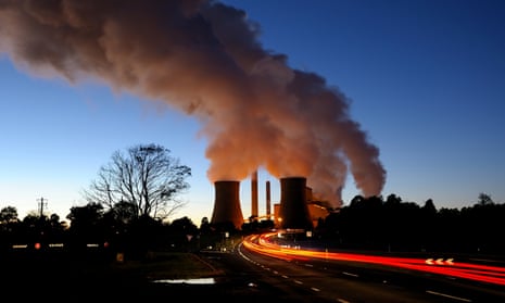 Steam from coal-fired power station at dusk