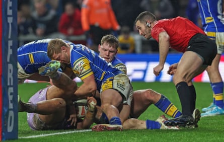 Referee Jack Smith takes charge of a match between Wigan and Leeds