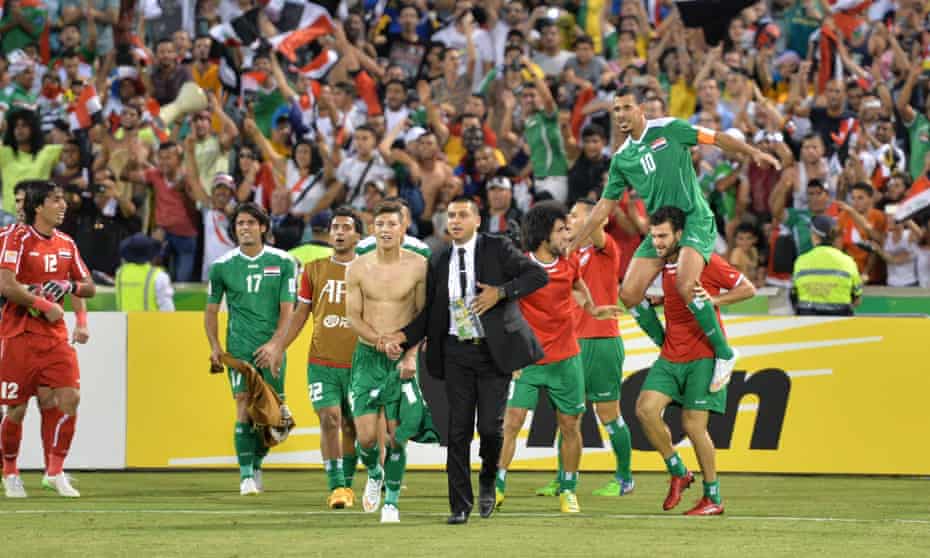 Younis Mahmoud is chaired off the pitch following the Iran game.