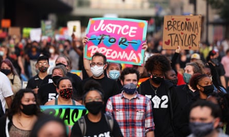 People march in Louisville, Kentucky, on 26 September. 