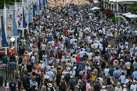 Fans walk along the concourse outside of Arthur Ashe Stadium