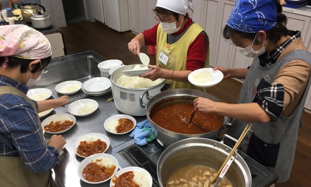 Volunteers prepare meals at a children’s cafeteria in Kawaguchi, Saitama prefecture, Japan.
