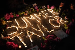 Protesters hold a vigil to honor Summer Taylor, who died after they were hit by a car during a recent protest