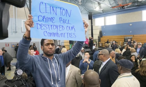 Protester Rosco Farmer is corralled in the back of the auditorium by civil affairs officers near the end of former President Bill Clinton rally for Democratic presidential candidate Hillary Clinton, Thursday, April 7, 2016, in Philadelphia. Bill Clinton was interrupted by people in the crowd holding signs reading “Clinton crime bill destroyed our communities” and “Welfare reform increased poverty.” (Ed Hille/The Philadelphia Inquirer via AP) PHIX OUT; TV OUT; MAGS OUT; NEWARK OUT; MANDATORY CREDIT